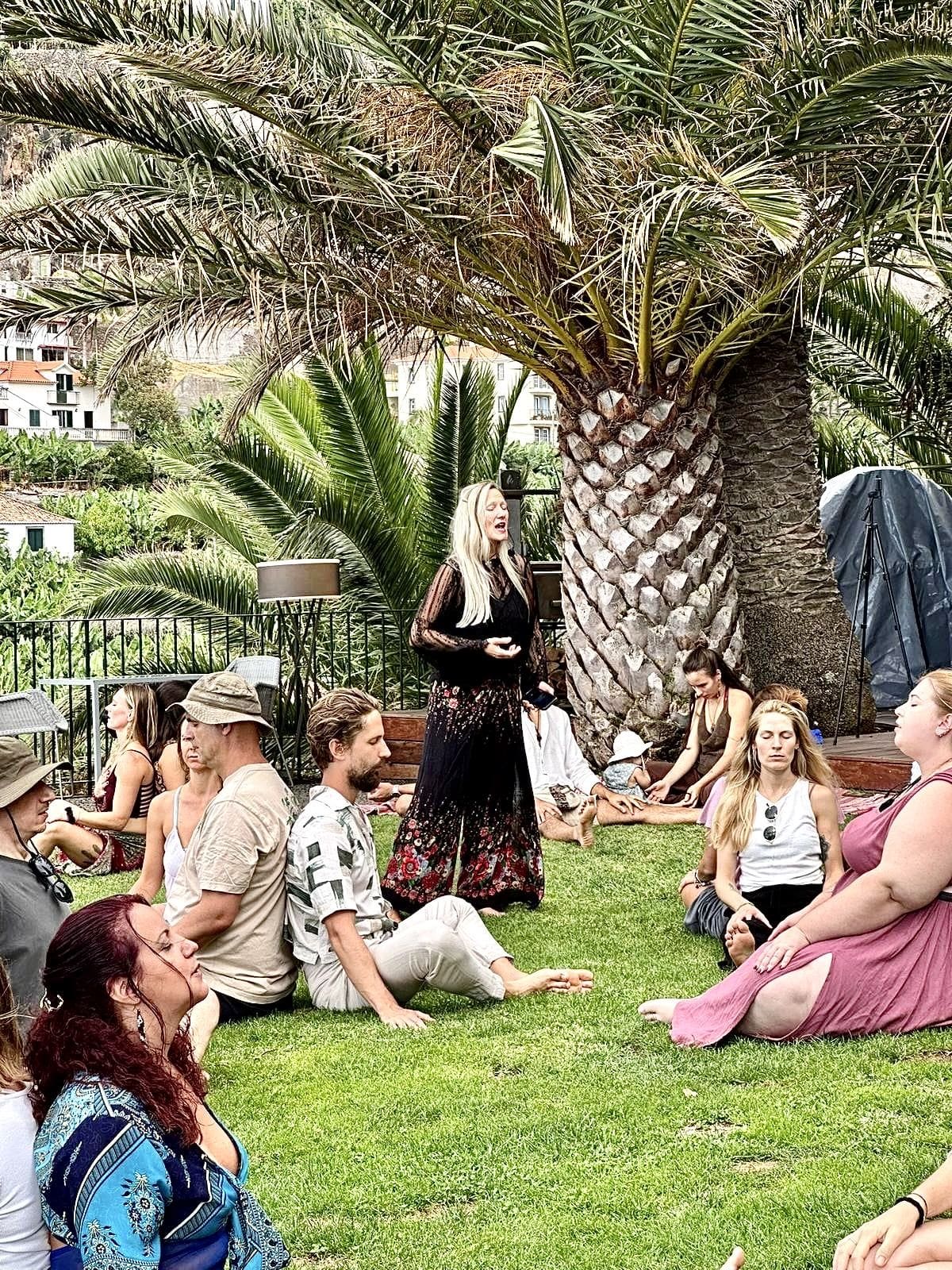 A circle of women in a garden